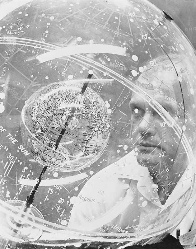 (1961) Mercury astronaut John H. Glenn Jr. looks into a Celestial Training Device (globe) during training in the Aeromedical Laboratory at Cape Canaveral, Florida.