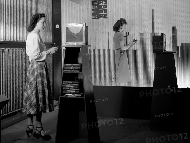 Female computers at the National Advisory Committee for Aeronautics (NACA) Lewis Flight Propulsion Laboratory copy pressure readings from rows of manometers below the 18- by 18-inch Supersonic Wind Tunnel. ca. 1949