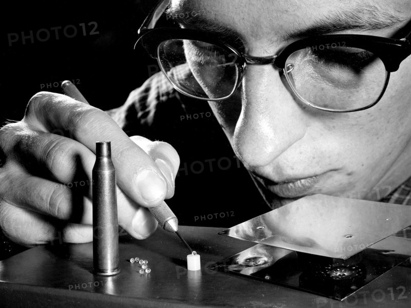 Researcher Examines Pellets for Micrometeorite Impact Studies ca. 1959