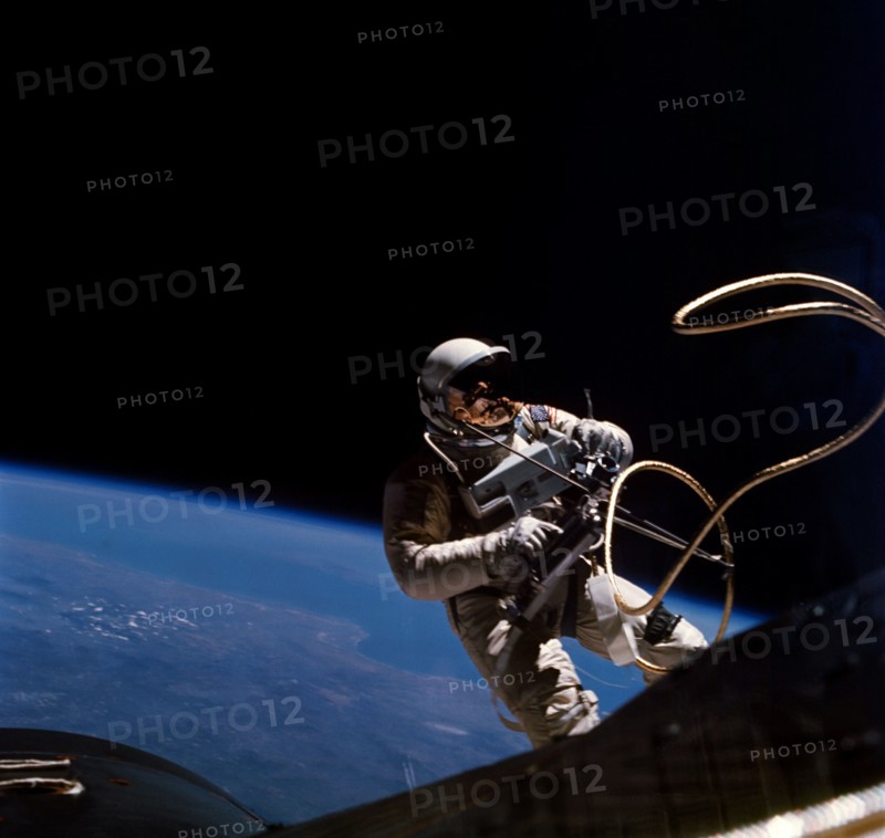June 1965) Astronaut Edward H. White II, pilot on the Gemini-Titan 4 spaceflight, is shown during his egress from the spacecraft.
