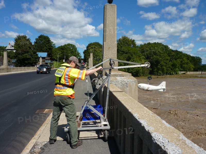 USGS worker collects a Hurricane Irene sample at the Mohawk River at Cohoes on August 29, 2010