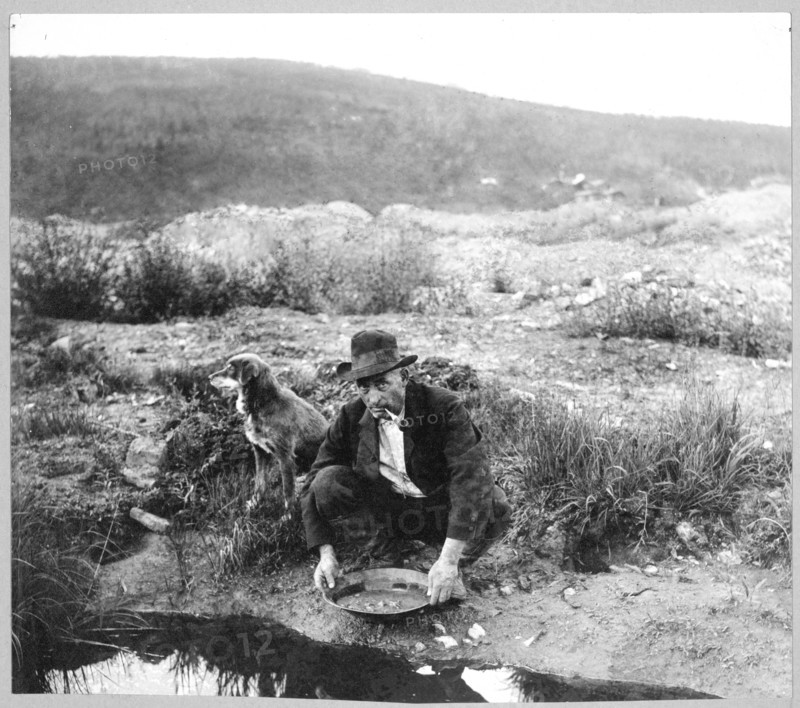 Miner panning gold 1916