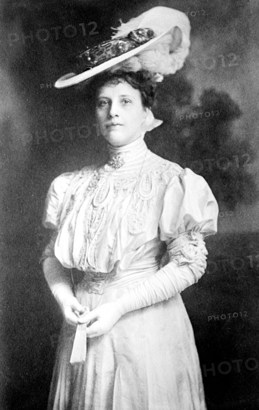 Gertrude Beeks, standing three-quarters
