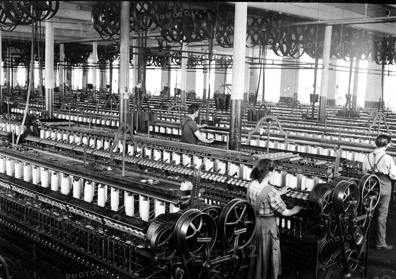 Three spinners in spinning room, 1912