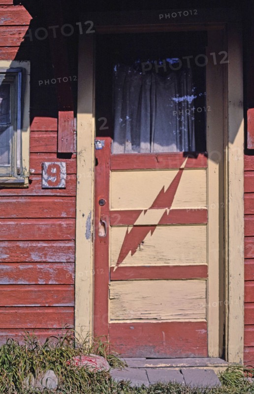 1980s United States -  Cabins cabin #9 lightning door detail Route 89 Saint Mary Montana ca. 1987