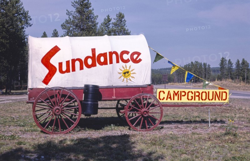 1980s United States -  Sundance Camp Ground sign and Wagon, Route 2, Coram, Montana 1987