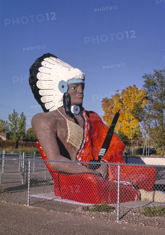 1990s United States -  Moqui Indian Trading Post, Route 40, statue sign, Roosevelt, Utah 1991