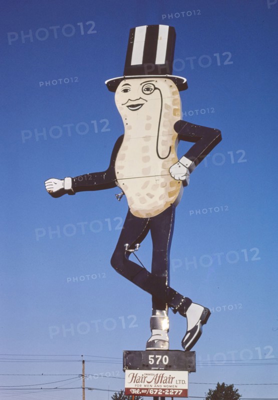 1980s United States -  Mr Peanut sign, Hair Affair sign, Route 6, Swansea, Massachusetts 1984