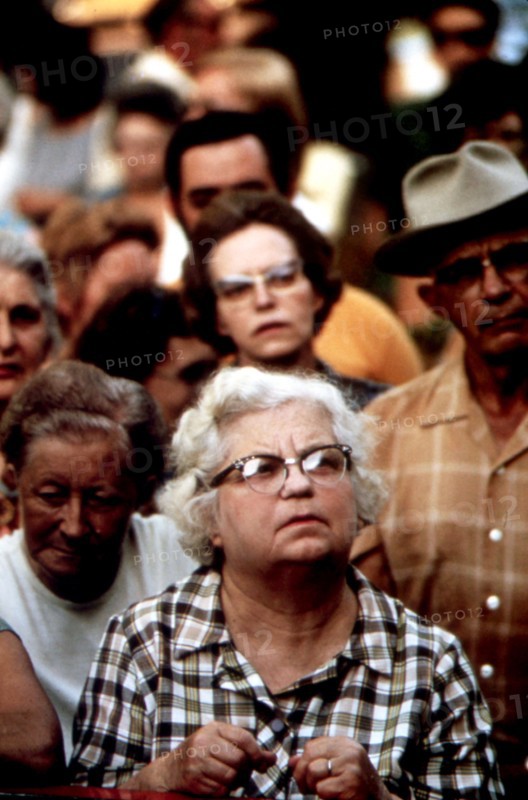 Audience member at an Auction of Household Goods in a Residential Area ca. 1975