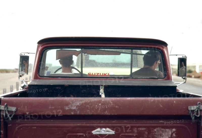 Rifle in pickup truck, 06 1973 Wyoming