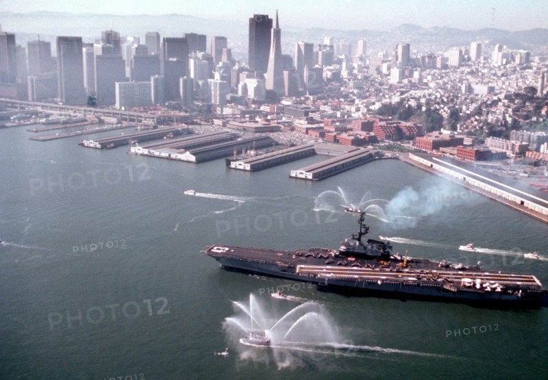 Harbor tug spraying water