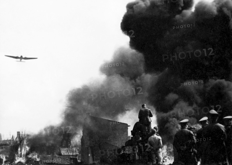German forces enter Warsaw in late September 1939 (according to notes that come with the print), or Germans during Warsaw Uprising (according to research)
