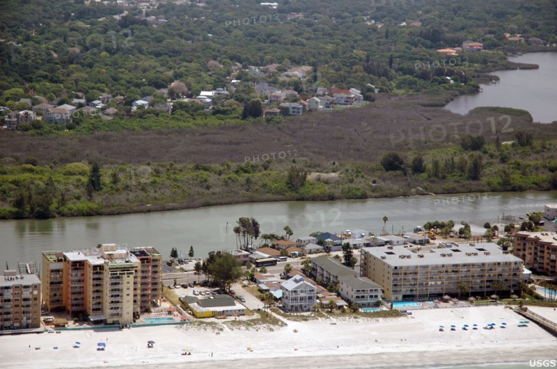 Florida's mangrove forests were hard hit by the uncommonly cold temperatures in January, 2010. Here, a dull brown swath of freeze-damaged mangroves cuts across the photograph, Pinellas County, FL -  ca. May 2010