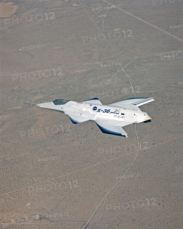 The tailless X-36 technology demonstrator research aircraft cruises over the California desert at low altitude during a 1997 research flight