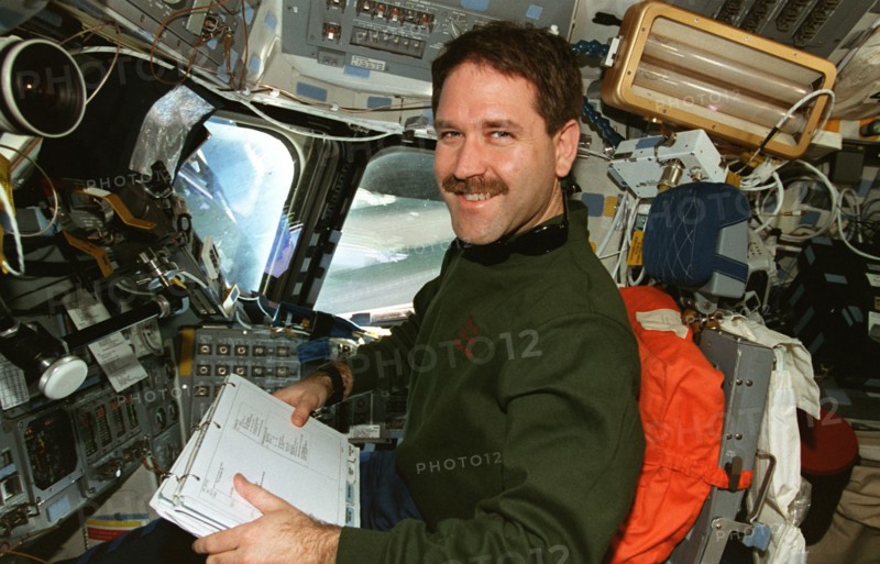 MS Grunsfeld at pilot's station on forward flight deck
