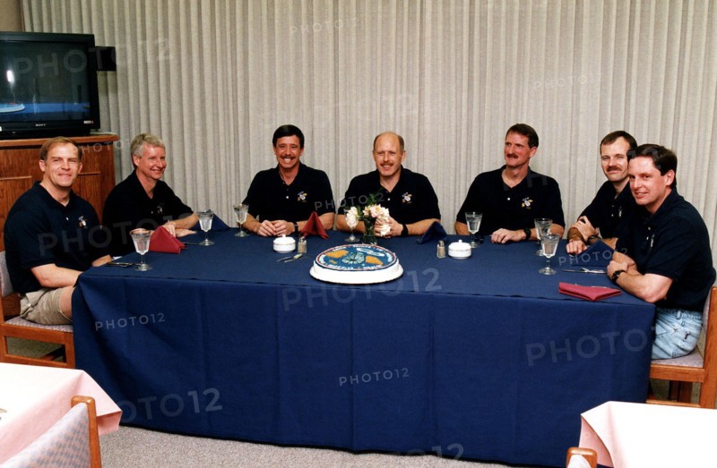 As part of the final STS-82 prelaunch activities, the seven crew members gather for lunch and a photo opportunity in the Operations and Checkout Building ca. 1997