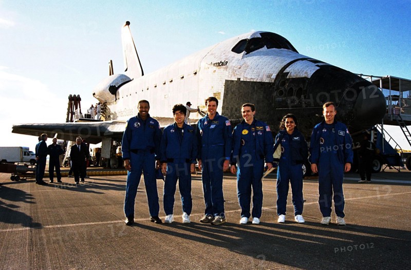 The STS-87 crew pose in front of the orbiter Columbia shortly after landing on Runway 33 at KSC's Shuttle Landing Facility ca. 1997