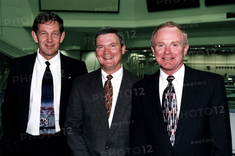 Roy D. Bridges Jr., KSC's next center director, at right, poses in the firing room of the Launch Control Center with two top contractor officials, L to R Michael McCulley and Bruce Melnick ca. 1997