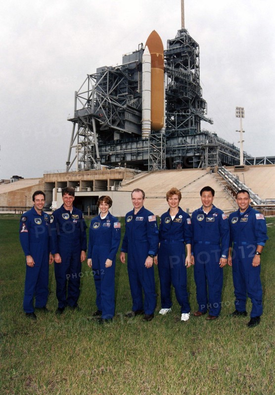 STS-84 crew members pose for a group photograph at Launch Pad 39A ca. 1997