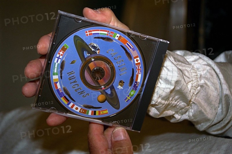 In the Payload Hazardous Servicing Facility (PHSF), a Digital Video Disk (DVD) bearing 616,400 digitized signatures of people from nations around the world is attached to the Cassini spacecraft ca. 1997