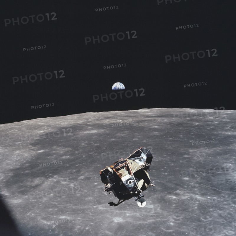 (21 July 1969) --- The Apollo 11 Lunar Module ascent stage, with astronauts Neil A. Armstrong and Edwin E. Aldrin Jr. aboard, is photographed from the Command and Service Modules (CSM)