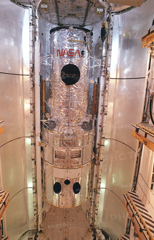 1990 - This photograph shows the Hubble Space Telescope (HST) installed in the cargo bay of the Space Shuttle Orbiter Discovery for the STS-31 Mission