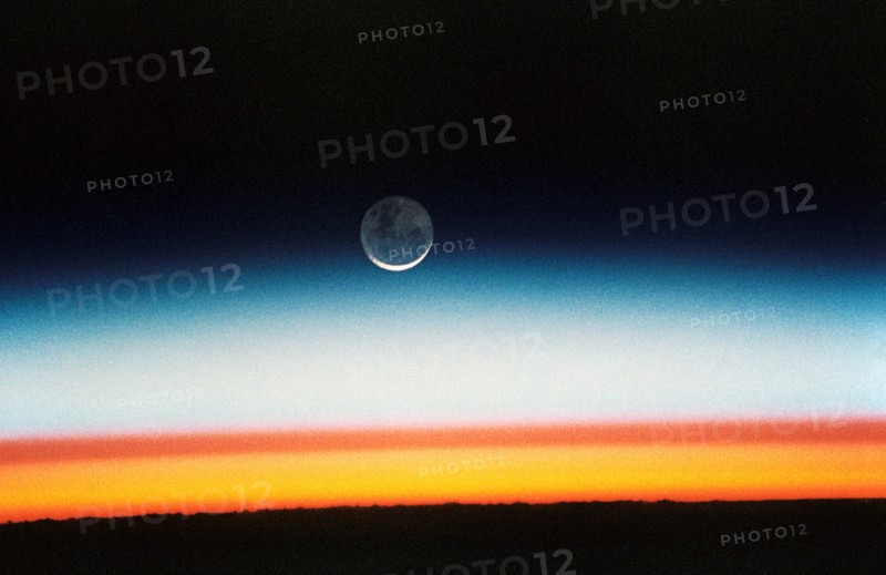 (22 Oct.-1 Nov. 1992) --- As the Space Shuttle Columbia orbited Earth in an easterly direction over the Indian Ocean, moonrise was followed quickly by sunrise.