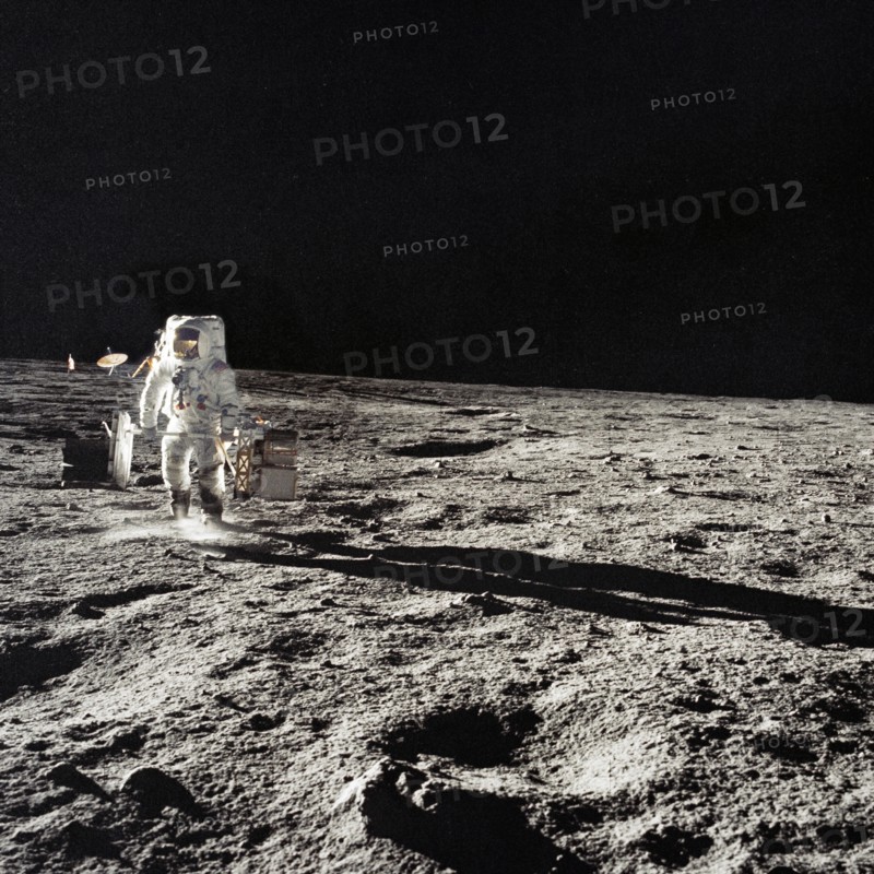 Astronaut Alan Bean with subpackages of the ALSEP during EVA