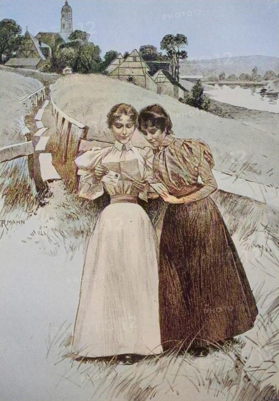 Two girls read a love letter together