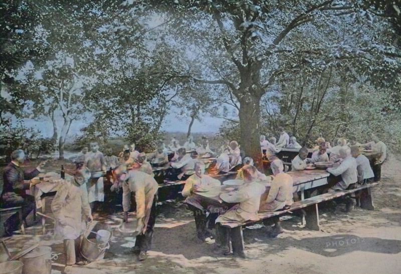 Orphans in Berlin having lunch in the garden