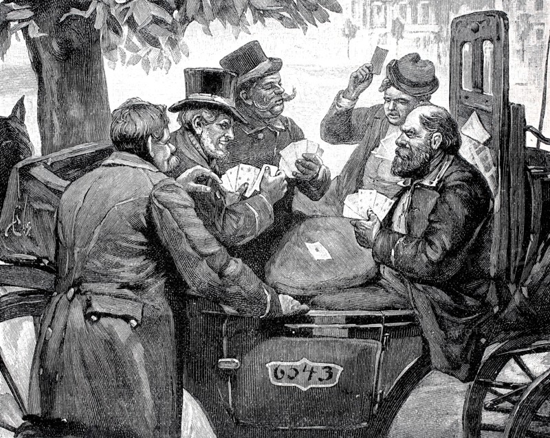 Men playing cards in a carriage