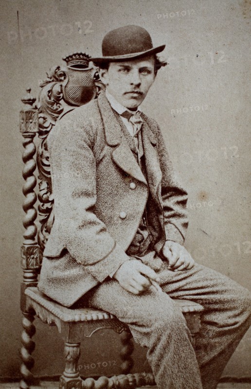 Photo of a man with suit and bowler hat