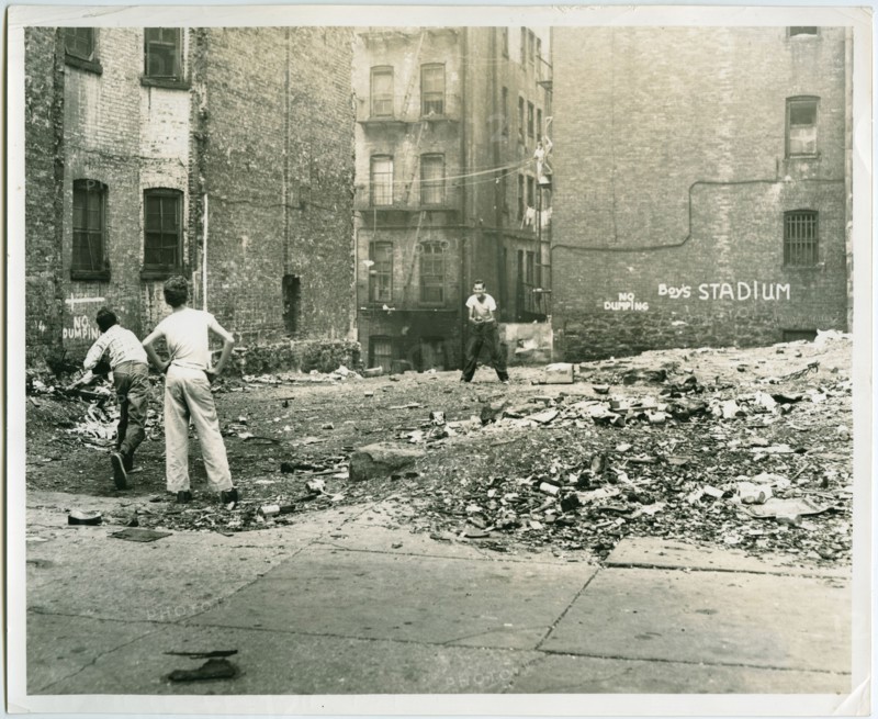 Playing catch outside tenement buildings