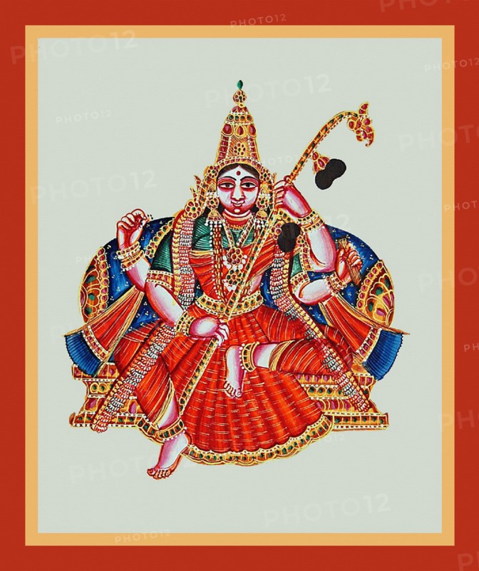 Goddess Sarasvati sits in lalitasana on a throne