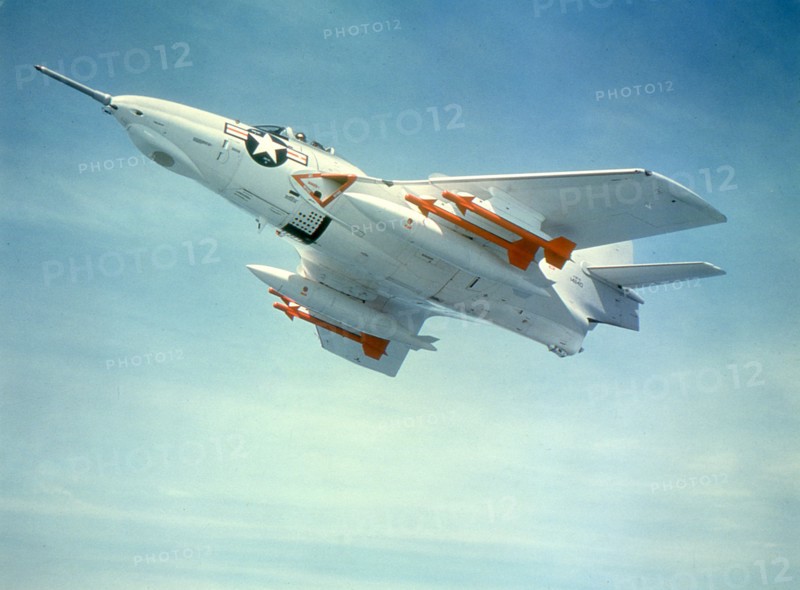 U.S. Navy F9F-8 aircraft with Sidewinder guided missiles. 1960.