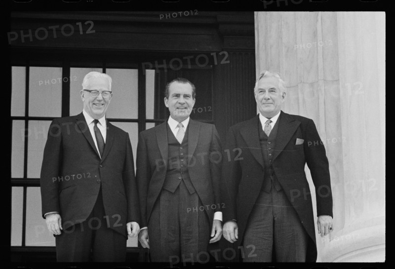 New Chief Justice of the Supreme Court Warren E. Burger (far right) standing with (from l-r) former Chief Justice Earl Warren and President Richard M. Nixon, Washington, DC, 6/23/69)
