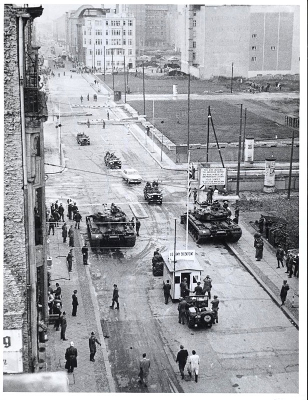 Berlin, October 1961. - Beginning August 23, when the East German police closed all but seven of the crossing points between the two parts of this city and limited access for allied personnel to Friedrich Strasse, the Communists attempted to limit the entry of Americans into the Soviet Sector. This campaign reached a climax in late October, when the 'People's Police' insisted upon identification of persons entering East Berlin in official American cars. The Americans, under instructions from their government, refused to identify themselves.  As a demonstration of the right of access to East Berlin the U.S. Army on October 26 escorted an American car past the communist police lines at Friedrich Strasse. The police permitted the car to pass without identification.