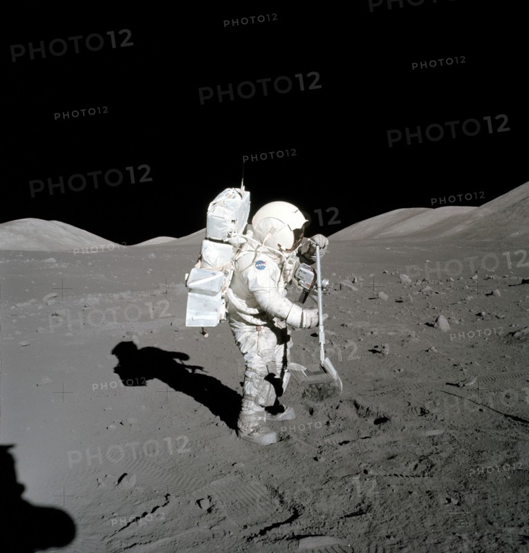 Astronaut Harrison Schmitt collects lunar rake samples during EVA