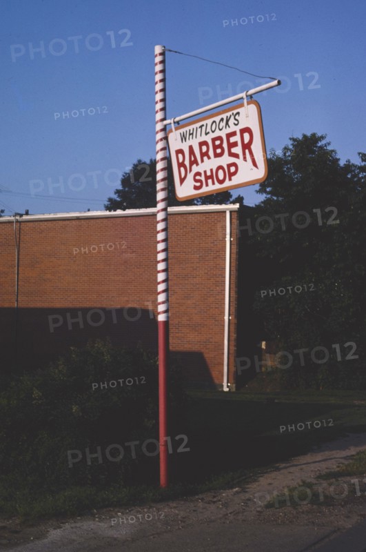1980s America -  Whitlock's Barber Shop sign