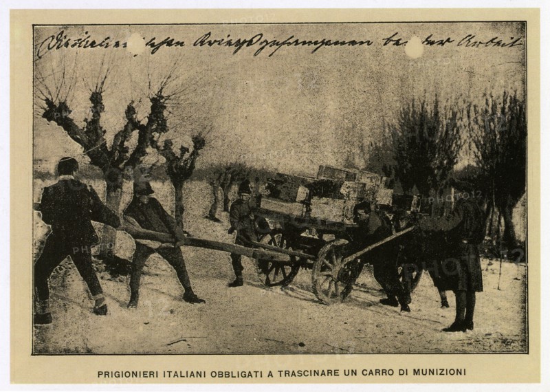 Italian prisoners forced to drag an ammunition wagon
