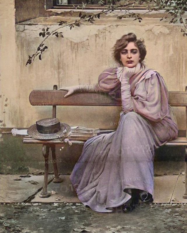 Pretty Woman With Dreamy Look Sitting On A Bench