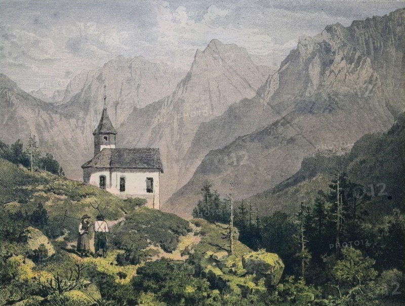 A Farmers Couple Near A Chapel At The Kaiser Mountains