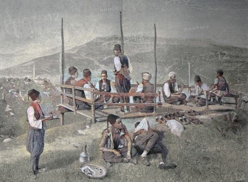 A Garden Cafe In Bosnia With Local Visitors