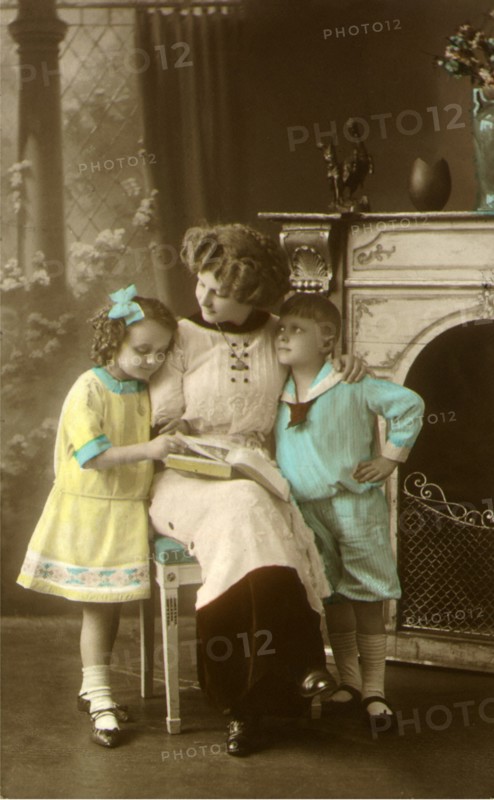 Mother and Children Read Together.