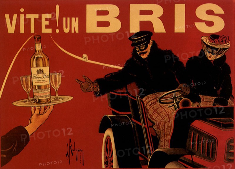 Man in Automobile reaches for Drink.