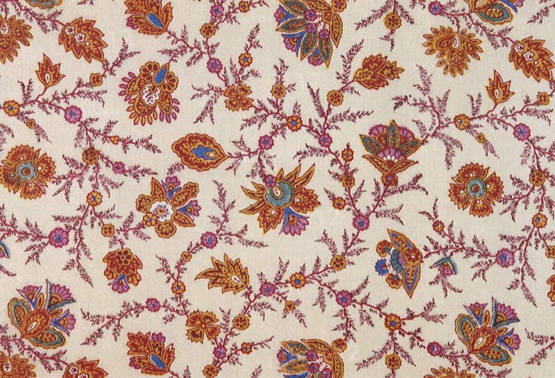 Paisley influenced floral pattern repeat on off white field.