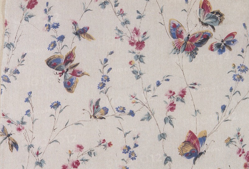 Butterfly and floral repeat pattern on white background.