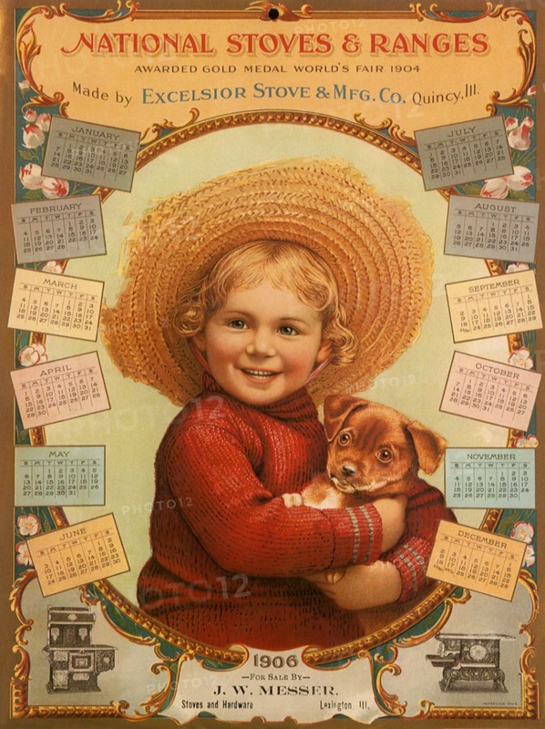 Girl in Straw Hat holds Puppy.