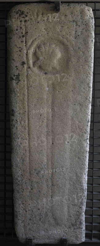 Tombstone with cord and scallop, Franciscan symbols