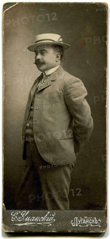 A man in the hat.